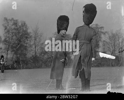 Prince of Wales inspects his regiment on St Davids day at Aldershot . The Prince of Wales inspected the 1st Battalion Welsh Guards , of which he is colonel in Chief at their barracks at Aldershot on St Davids day . The Prince of Wales saluting the regimental Colours as they were carried past him on the parade ground . 1 March 1932 Stock Photo