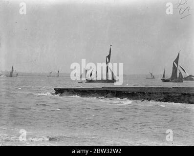 Sailing barges race down the Thames . Sailing barges used on the Thames took part in the annual race from the lower Hope reach , down the river . The sailing barges manoeuvring for position at the start of the race from Lower Hope Reach , Gravesend . 28 June 1932 Stock Photo