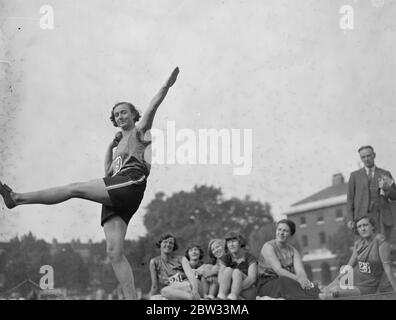 Throwing the discus at women 's inter county sports at Chelsea . Miss A Stone of Surrey , in fine action throwing the discus , at the women 's inter county sports , at the Duke of York 's Headquarters , Chelsea , London . 17 September 1932 Stock Photo