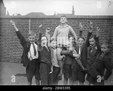 Brothers dive into Thames to rescue Roy . Two brothers , George Dallagan , aged 11 and Edward Dallagan , aged 14 , dived into the Thames from Globe Pier , Rotherhithe , London , to the rescue of a playmate , aged five , Victor Bowden , who was playing on the steps of the pier when he slipped and fell into the river . They were fully clothed but managed to rescue the boy . Cheering George Dallagan as he was chaired by schoolmates at Albany Road school , Rotherhithe , after the rescue . 19 September 1932 Stock Photo