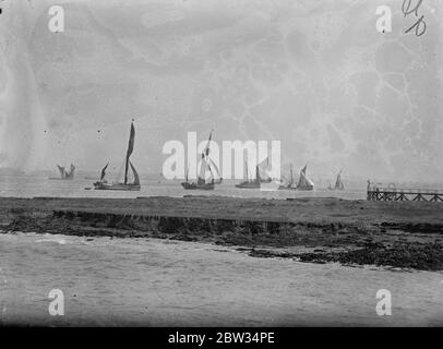 Sailing barges race down the Thames . Sailing barges used on the Thames took part in the annual race from the lower Hope reach , down the river . The sailing barges manoeuvring for position at the start of the race from Lower Hope Reach , Gravesend . 28 June 1932 Stock Photo