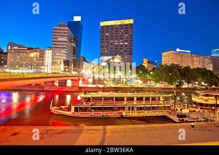 City of Vienna Danube river waterfront and boats evening view, capital od Austria Stock Photo