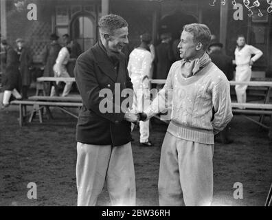 Rival captains in Inter varsity relay races at Oxford . J E Lovelock ( Oxford ) on right , and E I Davis of Cambridge , the two rival captains of the Oxford and Cambridge Universites relay teams , shaking hands before the start of the fourteenth annual inter varsity relay races at the Iffley track , Oxford . 25 November 1933 Stock Photo