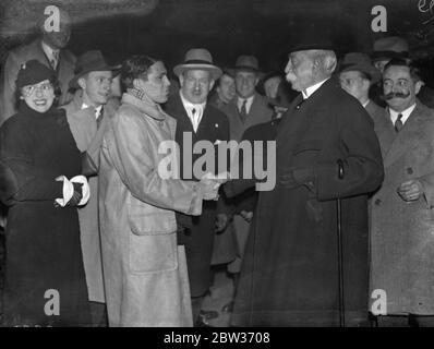 French footballers arrive for match with England at Tottenham ' s White Hart Lane football ground . The French football team which is to meet England at White Hart Lane tomorrow , arrived at Victoria Station , London . Photo shows ; E Delfour , the captain of the French team , being greeted by Sir Frederick Wall , Secretary of the Football Association , on arrival . 5 December 1933 Stock Photo