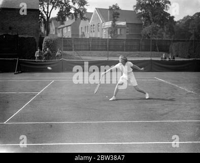 Youthful tennis stars meet at Wimbledon , to decide national title . There was a record entry for the British National Junior Lawn tennis Championships which opened at Wimbledon . Photo shows Miss A Bypass in fine action in the opening rounds of the tournament . 10 September 1934 Stock Photo