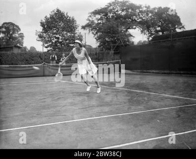 Youthful tennis stars meet at Wimbledon , to decide national title . Winners of the various County lawn tennis championships meet at Wimbledon to compete in the British National junior lawn tennis championships . The age limit for this tournament is fifteen . Photo shows , Miss Barnby ( in shorts ) in play . 10 September 1934 Stock Photo