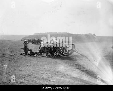 Champion batteries of the territorial field artillery of England , Scotland , and Wales are competing for the King ' s Prize at Larkhill on Salisbury Plain . Photo shows , the terrier gunners during the competition at Lark Hill . 27 Septemeber 1934 Stock Photo