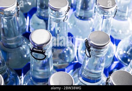 Fresh Sparking Mineral Water Close Up Photo. Drinking Water in Glass Bottles. Stock Photo