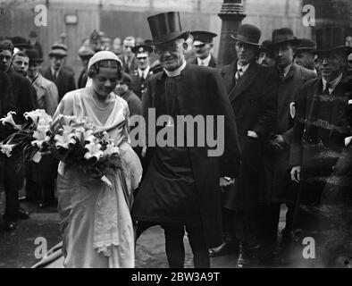 Three bishops at wedding of bishops daughter to bishop ' s son . Three bishops took part in the wedding at St Margaret ' s Church , Lothbury , City , of Miss Nancy Curzon , daughter of the Bishop of Stepney , to Mr Michael Willcox Perrin , son of the Assistant Bishop of London . The Bishop of London ( Dr Ingram ) with Bishop Perrin took the service , and the Bishop of Stepney gave his daughter away . Photo shows the bride and groom . 12 April 1934 Stock Photo