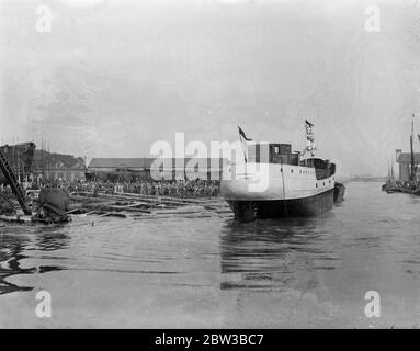 Largest ship ever built broadside in Kent takes to water at Faversham , Kent . 11 October 1934 . Stock Photo