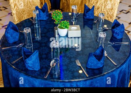 Closeup of banquet catering table set up for dinner Stock Photo