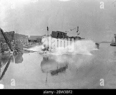 Largest ship ever built broadside in Kent takes to water at Faversham , Kent . 11 October 1934 . Stock Photo