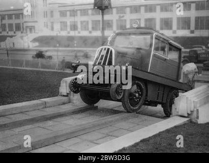 New road rail car undergoes first test can draw ten trucks and climb steps . A new diesel engined car which is equally at home on the road or on aa railway track was tested for the first time on the Great West Bead . 4 November 1935 Stock Photo