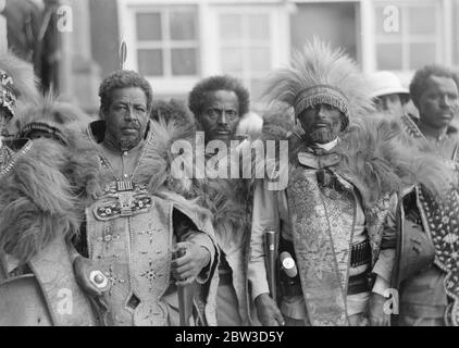 Emperor celebrates in midst of crisis anniversary of coronation . Despite the menace of the Italian invasion the anniversary of the coronation of Emperor Haile Selassie of Abyssinia was celebrated with regal pomp in Addis Ababa . The event was commemorated with a State procession through te town and a great military parade . Thousands of tribesmen led by important chieftains flocked into the capital to pay homage to their ruler and express their loyalty to him in the present crisis . Photo shows , three Chieftains who visited Addis Ababa to pay homage to the Emperor on the anniversary of his c Stock Photo