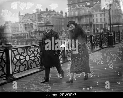 The Lord Chief Justice , Lord Hewart , walking along the pier at Brighton with his new bride , Lady Hewart on their honeymoon . 30 December 1934 Stock Photo