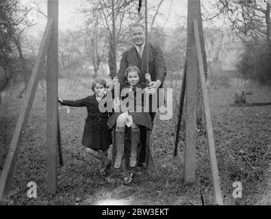 Englishman to count the votes of the Saar Plebiscite . Mr Ben Greene has been appointed Deputy Chief Returning Officer for the Saar Plebiscite . Photo shows ; Mr Ben Greene in his garden with his children . 30 December 1934 Stock Photo