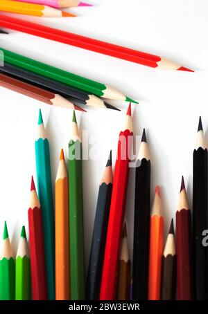 Many different colored pencils for children are brought together.