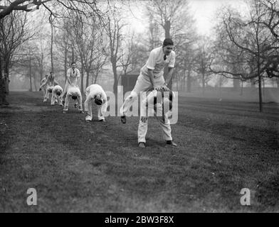 Cambridge boat race crew exercises at Hurlingham . The Cambridge boat race crew went through training exercises at the Hurlingham Club , London , in preparation for the annual meeting with Oxford nest month . Photo shows , the Cambridge crew playing leap frog at Hurlingham . 13 March 1936 Stock Photo