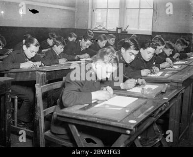 Boys in ' Blind Alley ' jobs saved from becoming derelicts . Messenger boys in the drawing class at the Kingsway Institute . 30 January 1935 Stock Photo