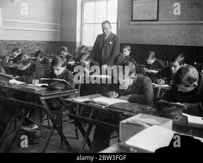 Boys in ' Blind Alley ' jobs saved from becoming derelicts . Messenger boys in the drawing class at the Kingsway Institute . 30 January 1935 Stock Photo