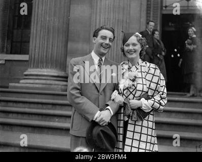 Scenario writer weds dancer at London register office . Mr Val Guest , the scenario writer who wrote ' Public Nuisance No 1 ' , was married at Marylebone Register Office to Miss Pat Watson , a dancer appearing in ' Seeing Stars ' at the Gaiety Theatre . the couple met a few weeks ago in a film studio . Photo shows , the bride and groom . 25 March 1936 Stock Photo