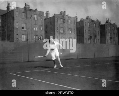 Betty Nuthall , playing in skirt instead of shorts , in action at Paddington . Miss Betty Nuthall in skirt , playing against Mrs List at Paddington , London . 31 March 1935 Stock Photo