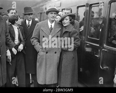 Dolores del Rio arrives in London . To work at Isleworth . Dolores del Rio and her husband , Cedric Gibbons , on arrival at Waterloo . 3 April 1935 Stock Photo