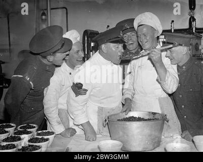 Woolwich barracks troops are making their own christmas pudding . For the first time men of the Royal Artillery at Woolwich Barracks are making their own Christmas puddings instead of buying them from outside . Six hundred men have to be catered for in the messroom and the work of preparing and mixing the puddings has already commenced . Liberal quantities of brand and stout are the most popular ingredients . Photo shows , the Sergeant cook has first taste in the kitchens at Woolwich barracks . 7 December 1935 Stock Photo