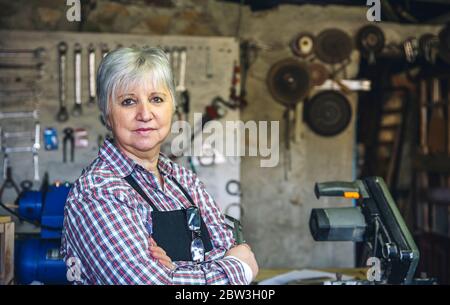 Female carpenter in his workshop Stock Photo