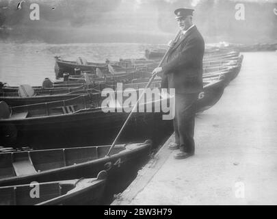 London boatman retiring after 46 years . Mr Charlie Potter with his boats in Victoria Park . 26 October 1935 Stock Photo
