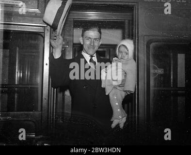 Canadian speedway champion , first to ride in England , arrives with wife and daughter . Speedway Champion of Canada , Eric Chitty , who will be the first Canadian to ride in this country , arrived at Waterloo Station , with his wife and twelve month year old daughter , Coral Anne , his mascot for the opening of the season . He is to ride for West Ham . Photo shows Eric Chitty photographed with his baby , Coral Anne , his mascot , on arrival at Waterloo . 25 March 1936 Stock Photo