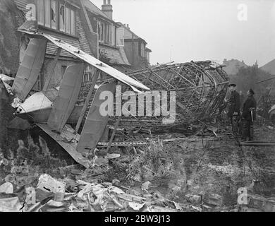 Air Ministry Officials Inspect Wreckage Of Plane In Which Four Were Killed . Four occupants of the Imperial Airways liner Vellox were reported killed when the plane crashed into the side of a house in Sandy Lane , Wallington , Surrey , when on its way to Paris in the early hours of the morning , the plane burst into flames . The Vellox was a twin - engine biplane and was being used on an experimental night air freight service between London and Paris . Photo shows : Squadron Leader Hillier , on behalf of the Air Ministry , and other officials examining the debris of the wrecked mail plane . 10 Stock Photo