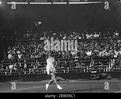 Dorothy Round Defeats Betty Nuthall In Women ' s Singles At WimbledonTennis Championships . Miss Dorothy Round had her first success in her bid to regain her Wimbledon title when she defeated Miss Betty Nuthall 9 - 7 , 6 - 3 in first round of the women singles at Wimbledon . Photo Shows : Dorothy Round in play against Betty Nuthall on the Centre Court . 23 Jun 1936 Stock Photo