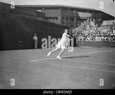 Helen Jacobs Defeats Mrs . Cable In Wimbledon Championships . Miss Helen Jacobs ( USA ) defeated Mrs . M . Cable of Great Britain 6 - 1, 6 - 0 in the first round of the women ' s singles in the Wimbledon Tennis Championships . Photo Shows : Miss Helen Jacobs in play against Mrs . Cable 23 Jun 1936 Stock Photo