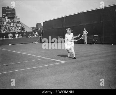Helen Jacobs Defeats Mrs . Cable In Wimbledon Championships . Miss Helen Jacobs ( USA ) defeated Mrs . Cable of Great Britain 6 - 1 , 6 - 0 in the first round of the women ' s singles in the Wimbledon Tennis Championships Photo Shows : Mrs . Cable in play against Helen Jacobs . 23 Jun 1936 Stock Photo