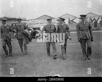 Chief of Air Staff tour aerodromes on Empire Air Day , starts from Hendon . Air Chief Marshal Sir Edward Ellington , Chief of the air Staff , is accompanying Lord Swinton ( with walking stick ) , the Air Minister , on his Empire Air Day tour of Royal Air Force stations . The tour started from hendon Aerodrome . Photo shows , Air Chief Marshal Sir Edward Ellington arriving at Hendon Aerodrome at the start of the tour . 23 May 1936 Stock Photo