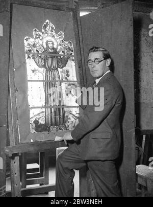 Famous London artist designs window for Christ 's Hospital Girls School . Mr James Hogen at work in his London studio on the stained glass window for Christ 's Hospital Girls School . 27 September 1935 Stock Photo