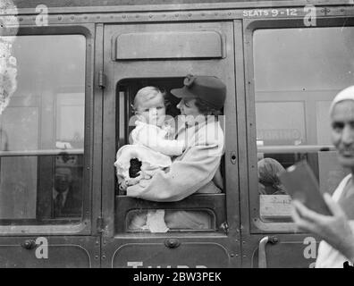 ' RMS Queen Mary ' s ' youngest passenger leaves London on boat train , 13 months old baby . The RMS Queen Mary ' s youngest passenger on her maiden voyage left Waterloo Station to go aboard at Southampton . He is Peter W Sommerscale , 13 months old son of Mr J B Sommerscale , a British Government official . The baby has travelled from Baghdad and now goes on to New York . Photo shows , little Peter Sommerscale with his mother, Mrs J B Sommerscale in their carriage window at Winterloo . 27 May 1936 Stock Photo
