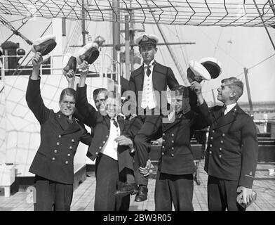 Prize Day on the HMS Worcester , the training ship of the Thames Nautical Training College in Greenhithe , Kent .Photo shows , Cadet R A N Cox winner of the King ' s Gold Medal , being chaired after the prize giving . 2 August 1935 Stock Photo