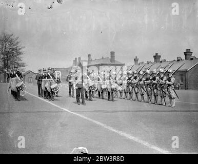 Elizabethan musketeers rehears for Royal Tournament . The 2nd Battalion , the Royal Norfolk Regiment , held a full rehearsal at Aldershot for the pageant which will be a feature of the Royal Tournament at Olympia . Photo shows , ' Musketeers ' of the Elizabethan period led by drummers . 30 April 1936 . Stock Photo