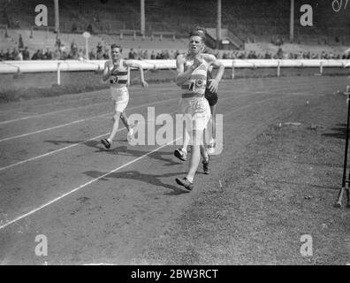 A . A . Cooper During The Mile Walk Race At London Police Sports A . A . Cooper of Woodford Green Athletic Association , attempting to lower the record . 25 Jul 1936 Stock Photo