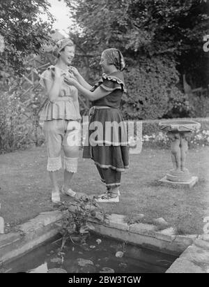 Guests wear bathing costumes of the 19 century at London party . At a party given by Dr W C Cunnington , the North London authority of the Victorian era , women guests wore bathing costumes of the 19 Century . Some of these dresses date back to before 1850 and are the only one of that period in existence . 12 July 1936 Stock Photo