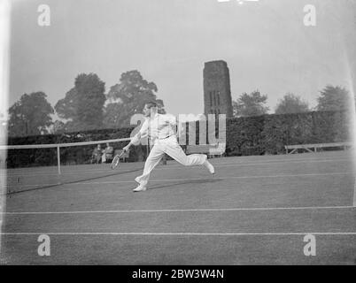 Baron Gottfried von Cramp a ' friendly ' with Austin at Wimbledon . Baron Gottfried von Cramm , the German tennis player , and H W Austin played a friendly match at Wimbledon in preparation for the opening of the tournament next Monday . Photo shows , Baron von Cramm in play against Austin . 19 June 1936 Stock Photo