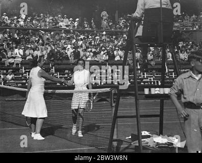 Dorothy Round Defeats Betty Nuthall In Women ' s Singles At WimbledonTennis Championships . Miss Dorothy Round had her first success in her bid to regain her Wimbledon title when she defeated Miss Betty Nuthall 9 - 7 , 6 - 3 in first round of the women singles at Wimbledon . Photo Shows : Dorothy Round being congratulated by Betty Nuthall after the match on the Centre Court . 23 Jun 1936 Stock Photo