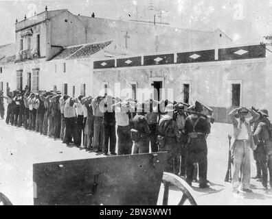 Rebel prisoners captured in Seville . Men who fought for the rebels taken prisoner by the government troops in Seville . According to these pictures , Seville must now be in the government hands . 8 August 1936 Stock Photo