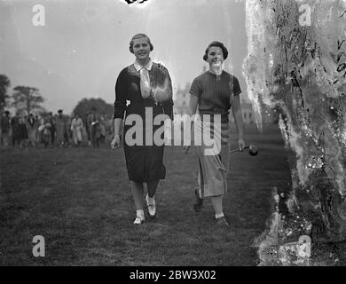 The opening matches in the Girls Open Golf Championship were played at Stoke Poges . Photo shows , Miss Joan Pemberton ( left ) of Bramall Park , 16 year old favourite for this year ' s competition and Miss Fiona R Morris ( Sandy Lodge ) walking from the first tee . Miss Pemberton was last year ' s runner up . 9 September 1936 Original caption from negative Stock Photo