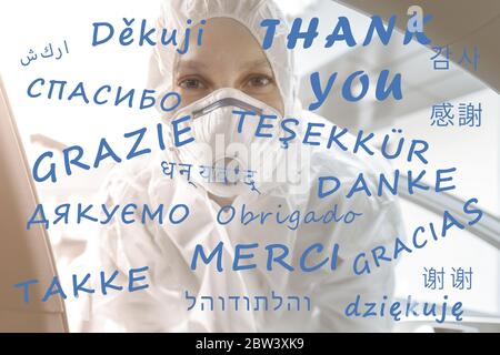 Thank you text on different world global languages with tired female nurse doctor or medical worker in ppe facemask on background. Gratitude to all Stock Photo
