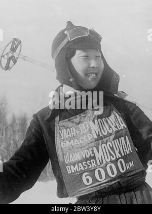 Soviet girl skiers fight gales and snow storms to set new World Record . 18 year old girl in party . Fighting against Siberian blizzards , gales and snow storms in the Ural Mountains , five young girls of the Buryat Mongolian Republic of the USSR , are nearing Moscow at the end of their world record ski run of 4 , 000 miles from Ulan Ude , capital of their native Siberian state , to Moscow . The youngest of the party is only 18 years of age , the eldest 24 . The previous record ski run was only 1 , 500 miles . Photo shows , smiling Marusya Khakhalova , 18 year youngest member of the record bre Stock Photo