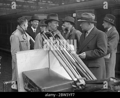 Naval commander leaves London with unit to make a first film of manoeuvres . Commander J L F Hunt Royal Navy , left Waterloo station with members of a film unit for Portsmouth to join HMS Suffolk from which he will produce a film of the manoeuvres of the British home Mediterranean Fleet . This is the first time in history the manoeuvres are being filmed , and when finished , the picture will be shown to the public . The theme of the film will record the adventures of two boys joined the Navy from the moment when they put on their uniforms until they find themselves under active service conditi Stock Photo