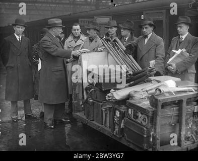 Naval commander leaves London with unit to make a first film of manoeuvres . Commander J L F Hunt Royal Navy , left Waterloo station with members of a film unit for Portsmouth to join HMS Suffolk from which he will produce a film of the manoeuvres of the British home Mediterranean Fleet . This is the first time in history the manoeuvres are being filmed , and when finished , the picture will be shown to the public . The theme of the film will record the adventures of two boys joined the Navy from the moment when they put on their uniforms until they find themselves under active service conditi Stock Photo